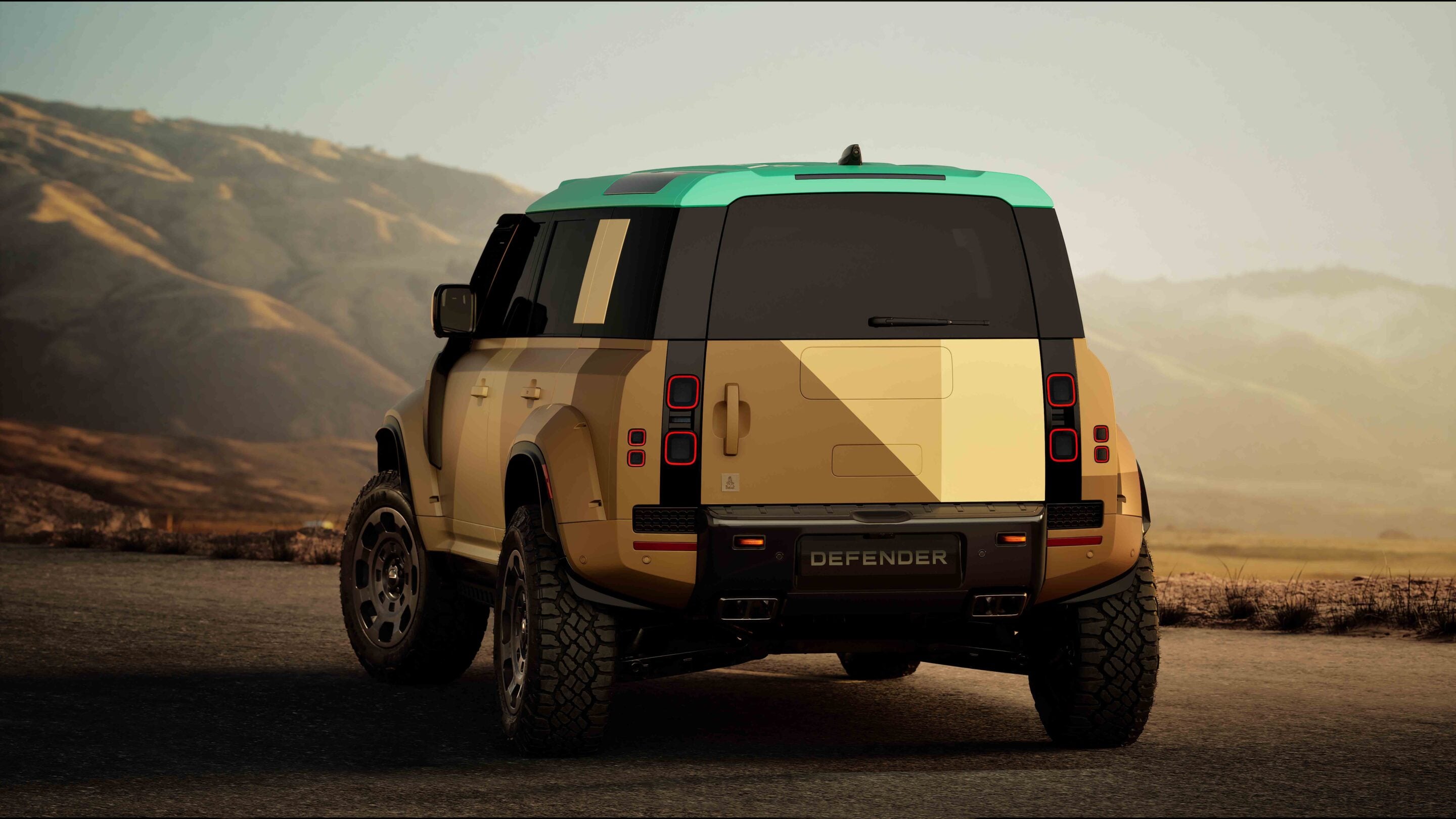 Rear view of a beige and green SUV (Defender) parked on a desert road at sunset with rugged tires and red taillights visible