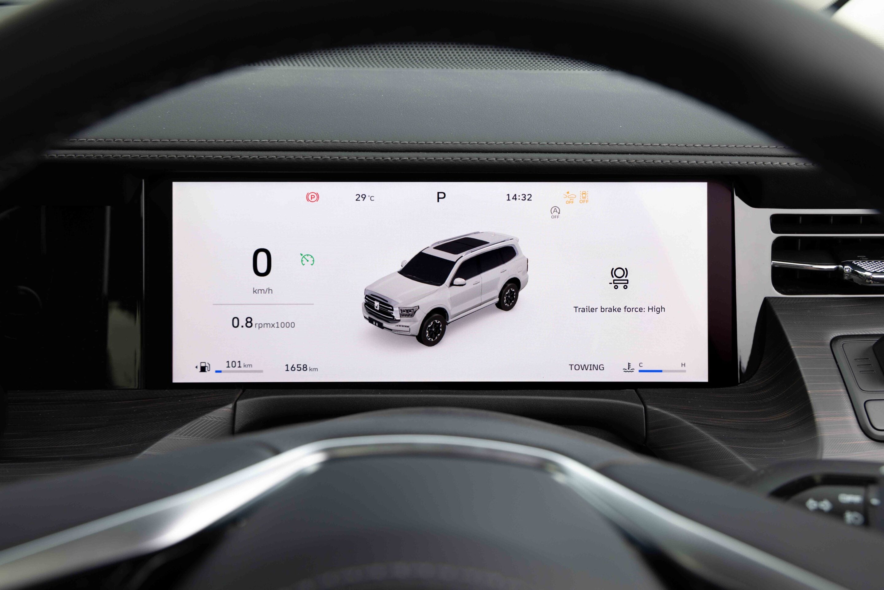 Infotainment screen in a car showing a 3D white SUV model, parked with speed 0 km/h and gear in P, plus trip data and range indicators.