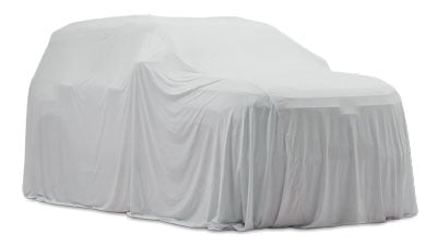 Car draped with a white fabric cover, concealing the vehicle underneath, as if awaiting reveal