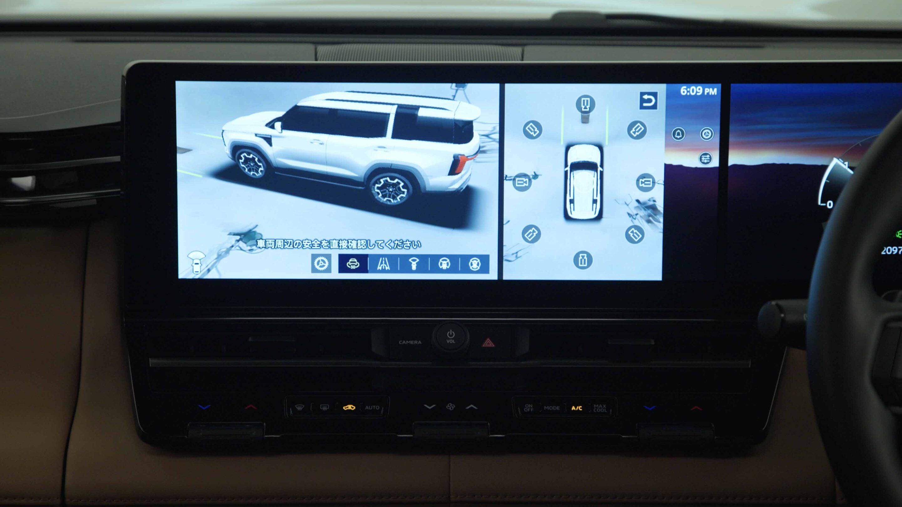 Car infotainment screen showing a 360° vehicle camera view with side and top-down images of the SUV.